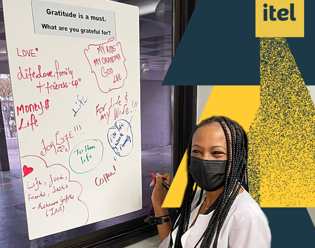 an itel employee writes a message of thankfulness on itel's Gratitude Board - part of itel's Health and Safety Month in February 2022