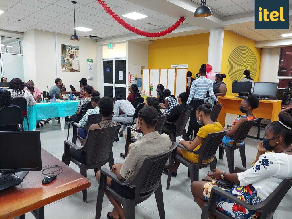 image of itel Guyana employees attending free health presentations at work, where they could obtain free health screenings and medical advice from local health practitioners. 